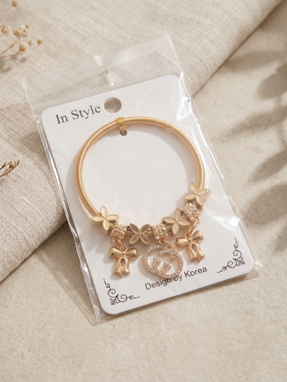 Brand NEW Gold Charm Bracelet with Floral and Bow Accents